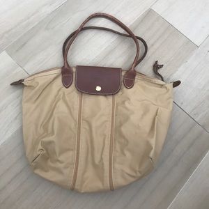 Tan and white longchamp medium tote