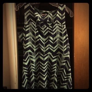 Xhileration  in blue chevron patterned dress.