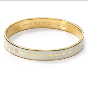 Kate Spade cream and gold bangle