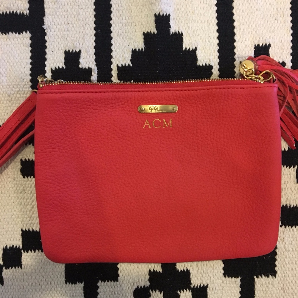 Gigi New York intial hot pink tassel clutch