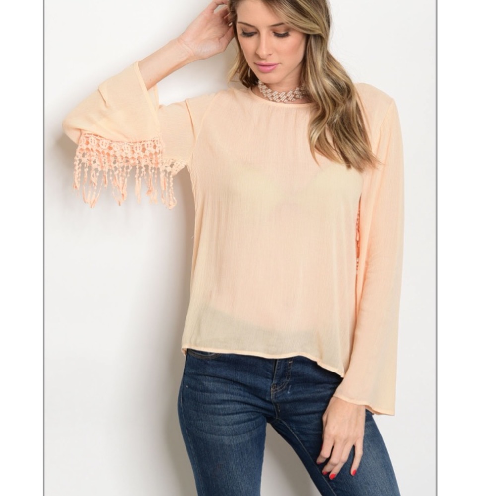 Peach blouse with fringe