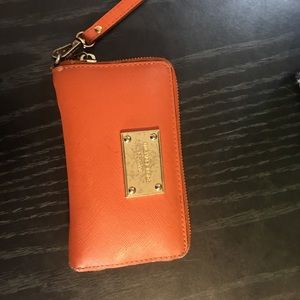 Used orange Micheal kors wallet
