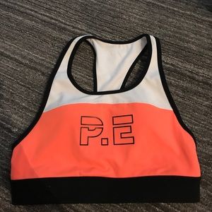PE Nation orange sports bra