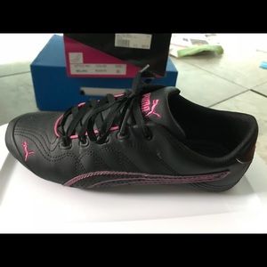 Pink and black pumas