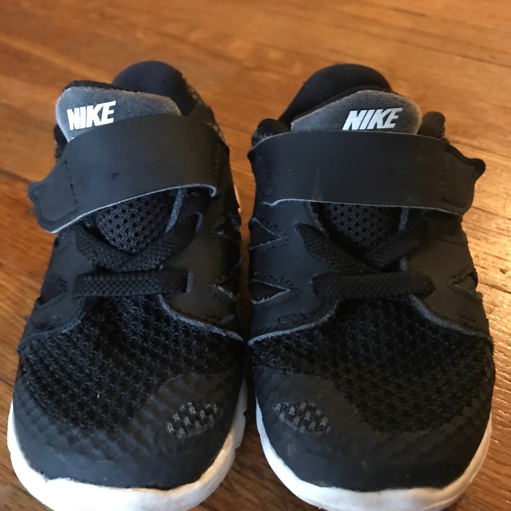 Boys black and white Nike sneakers