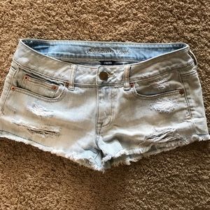 Light wash destroyed American Eagle jean shorts