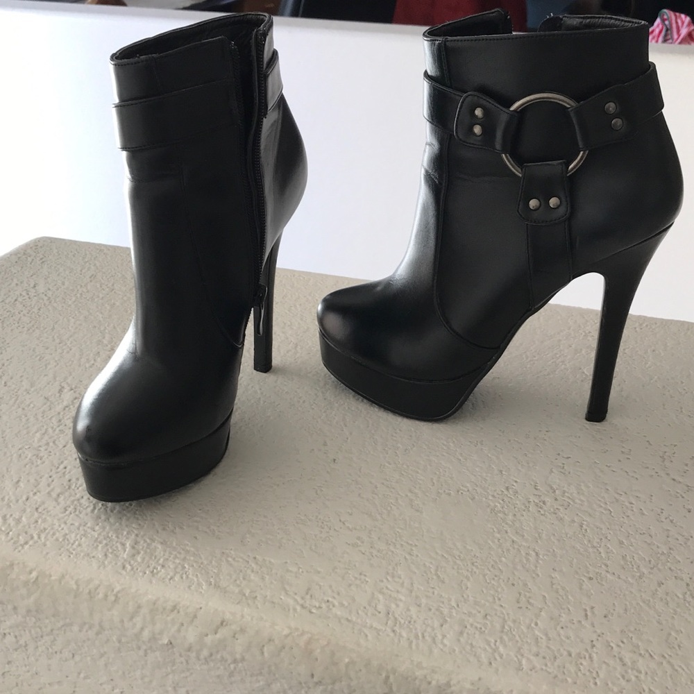 Very high black booties.