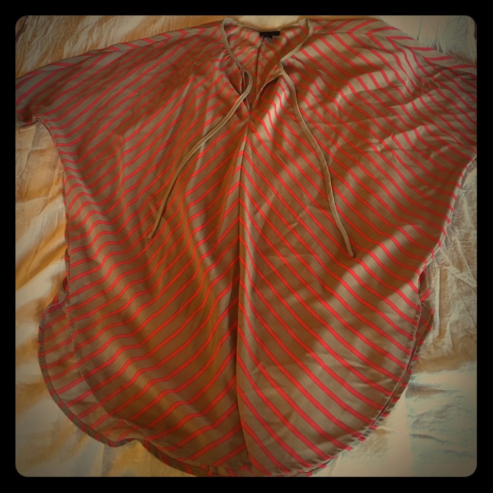 Pink and tan striped oversized top. Tie bow front