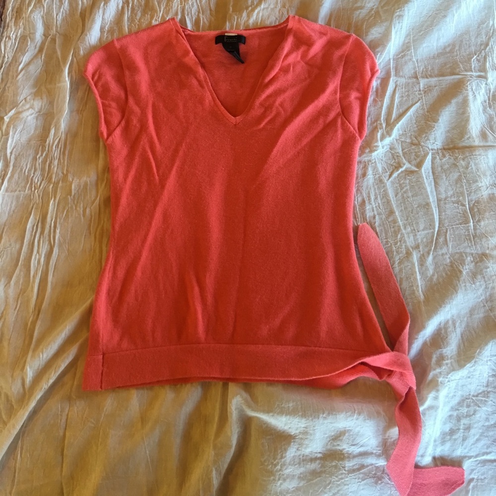 Coral short-sleeve v-neck sweater with tie side.