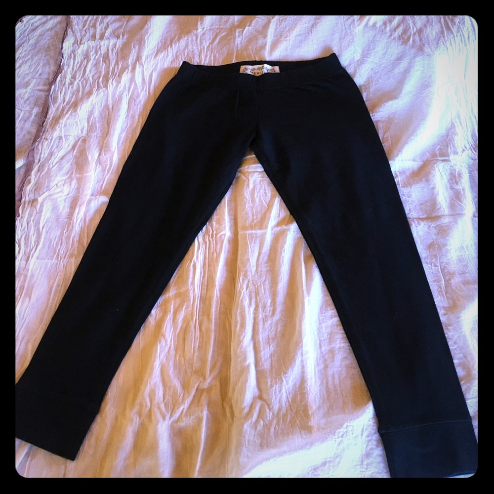 Black cotton/spandex leggings with band at ankle.