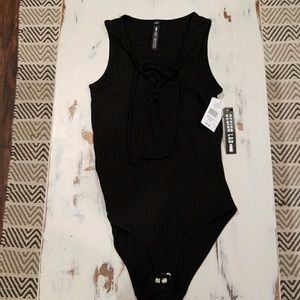 Black sleeveless bodysuit (s)