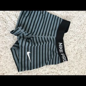 Black and grey striped Nike pros