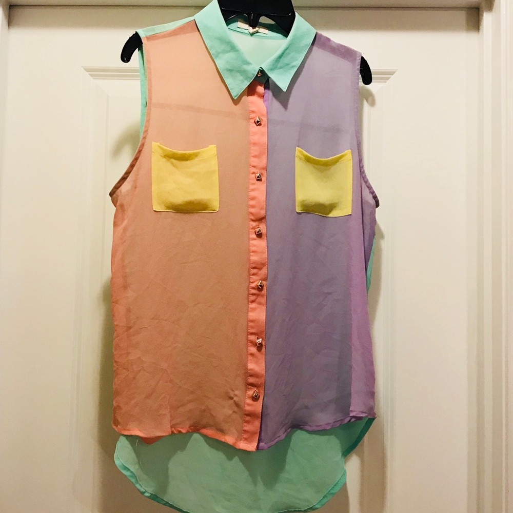 A sleeveless sheer pastel color blouse