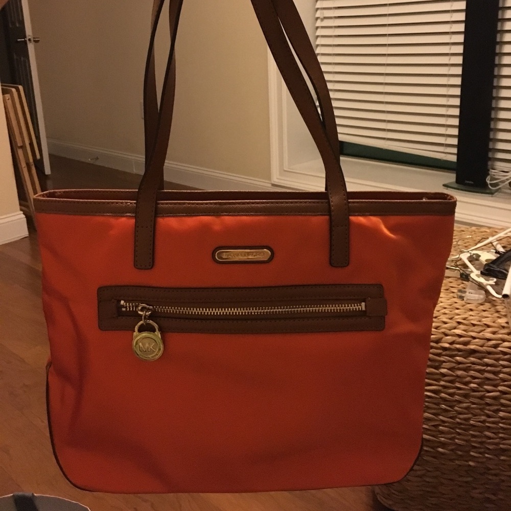 Orange medium sized Michael Kors bag