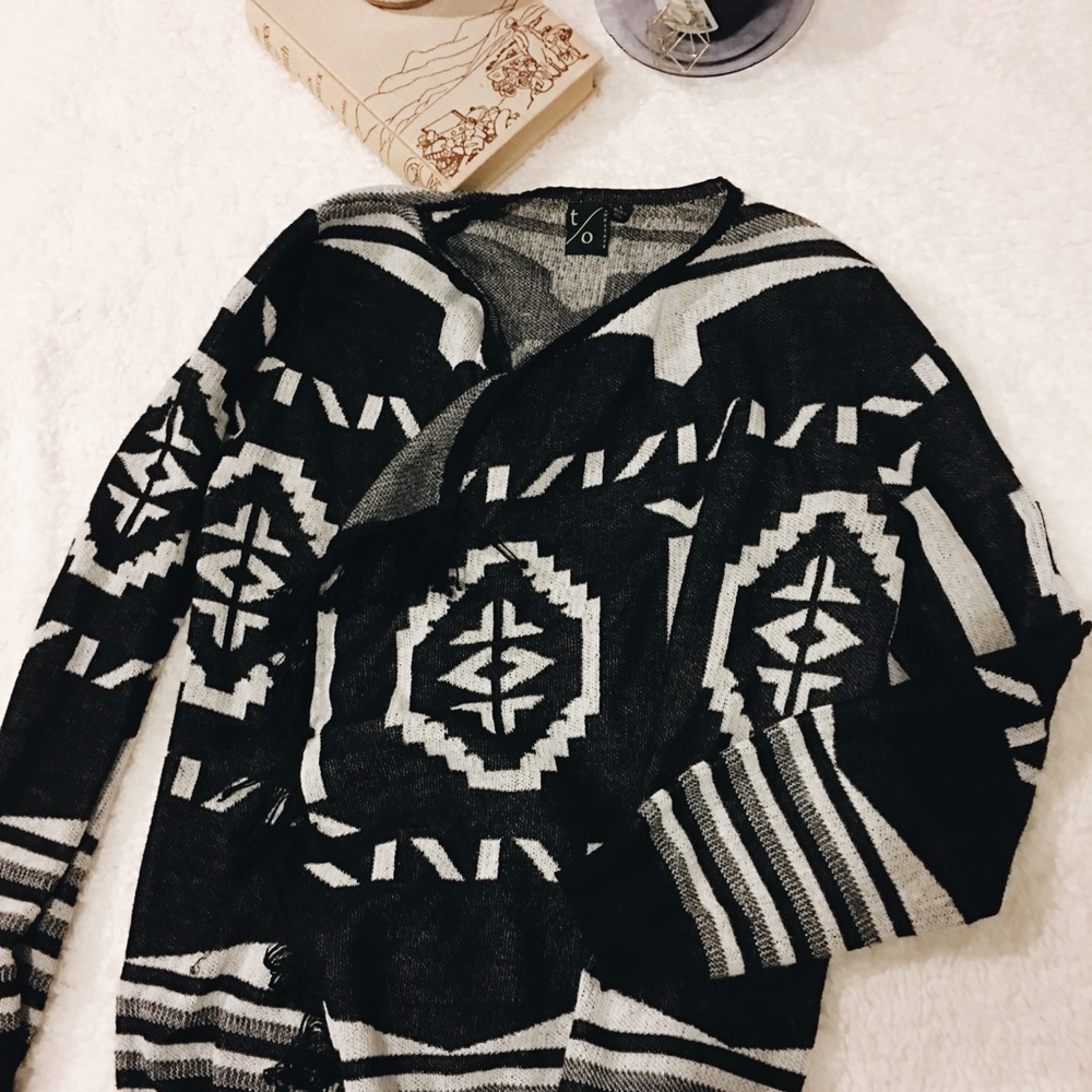 Black and white fringe wrap sweater