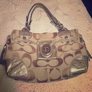 Used Coach purse, has some stains an wear on strap