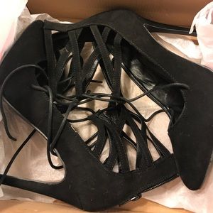 Black strappy suede pumps