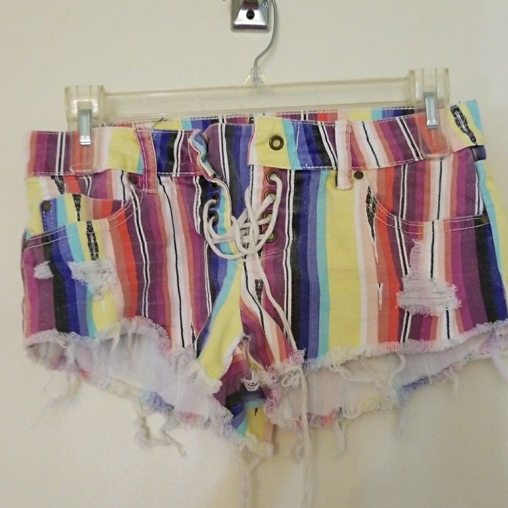 Distressed pinstripes lace up front shorts