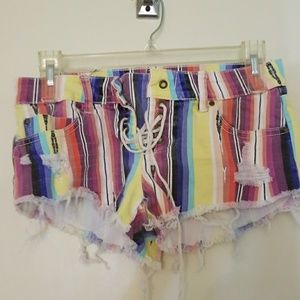 Distressed pinstripes lace up front shorts