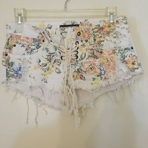 Floral distressed shorts