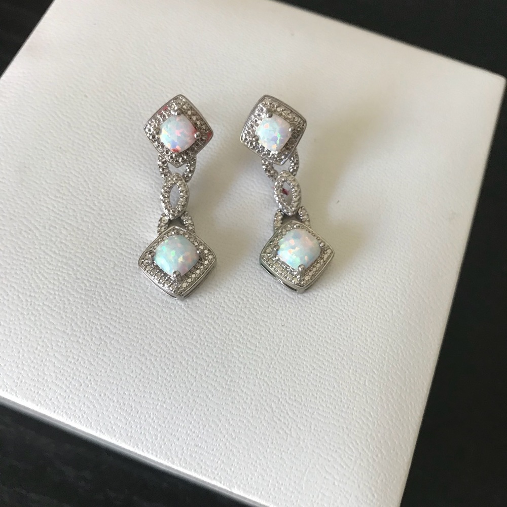 Pair of sterling silver and opal earrings.