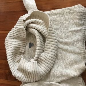 This sweater has never been worn. It’s mid length