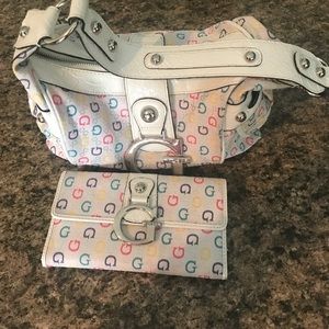 Lightly used Guess purse and wallet never used.
