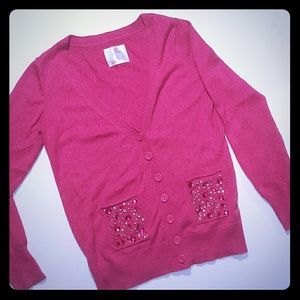 Justice sweater with rhinestone pockets.
