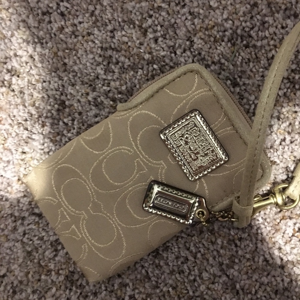 Small tan Coach wristlet