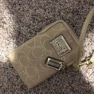 Small tan Coach wristlet
