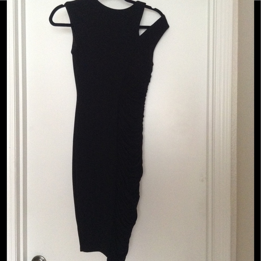 Sexy little black dress with ruching. New.