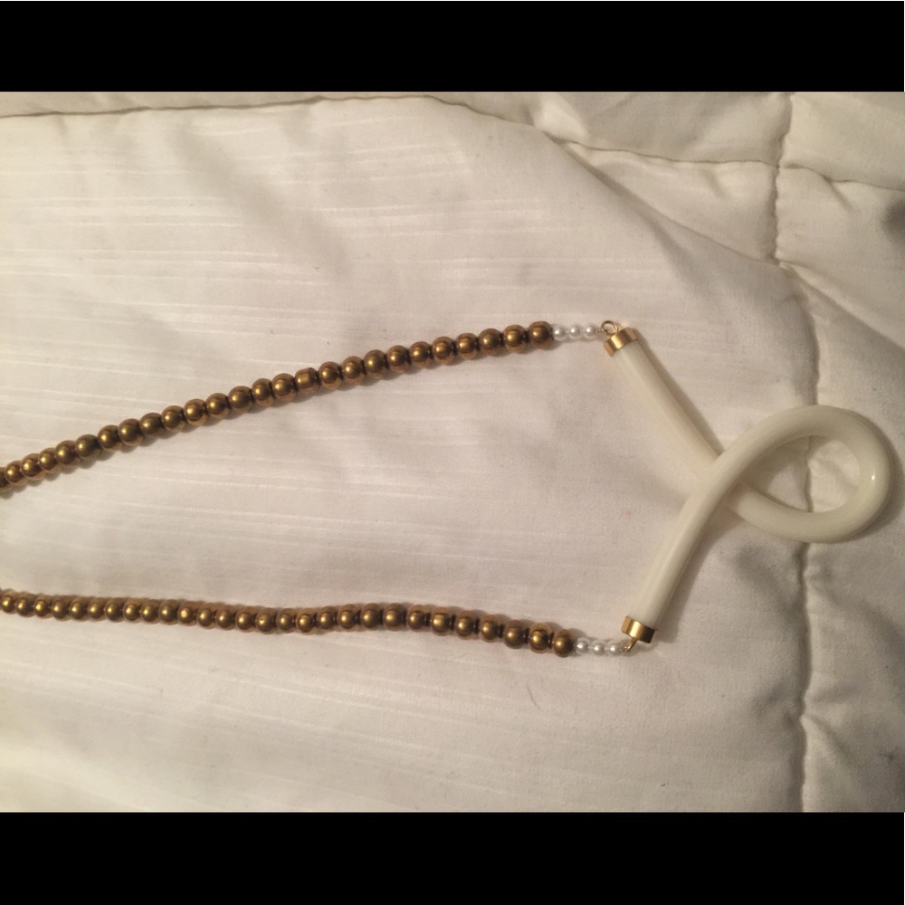 Gold beaded necklace with white design