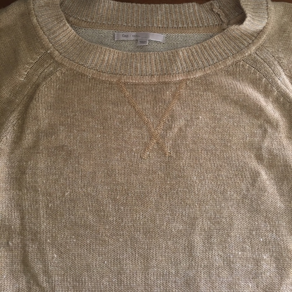 Tan sweater. Crew neck