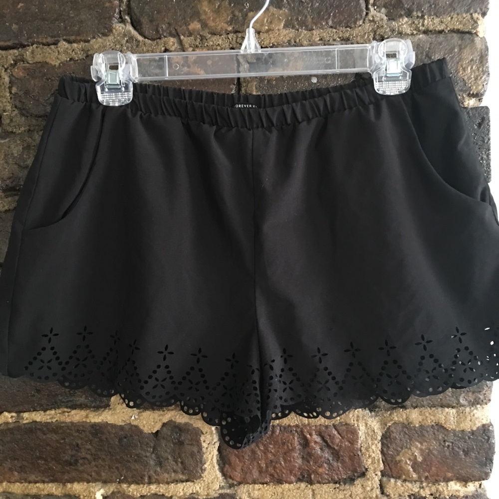 Black flowy shorts with cutout detailing
