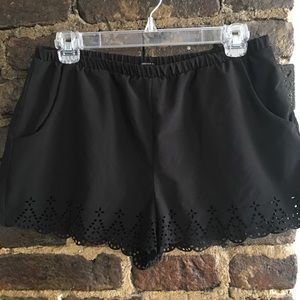 Black flowy shorts with cutout detailing