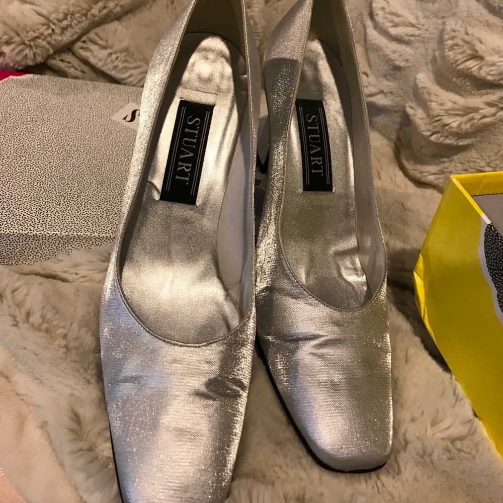 Stuart Weitzman silver heel shoes.