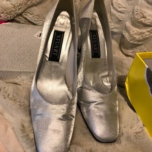 Stuart Weitzman silver heel shoes.