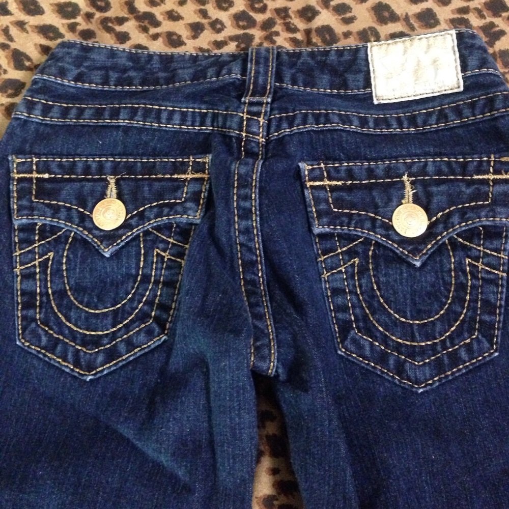 True Religions flared gold trim jeans