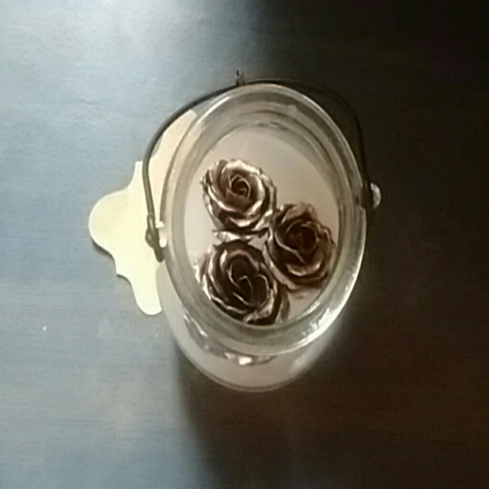 Handmade roses in a glass handled vase