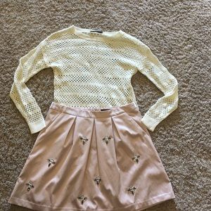 Pale pink silky skirt with embellishments