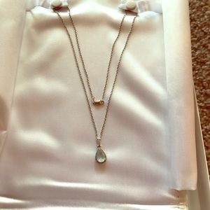 Aquamarine w/diamond halo necklace