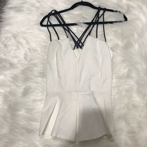 Strappy white and black peplum tank