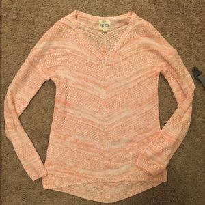 Light pink sweater.