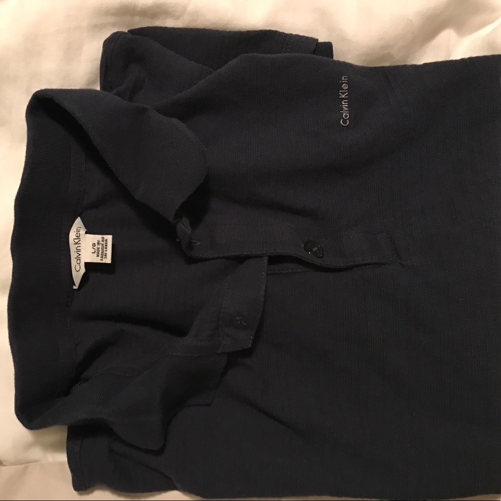 Calvin Klein polo fits medium/small