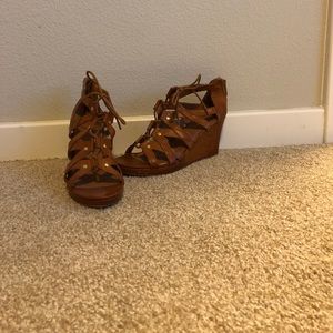 Brown tie up wedge shoes