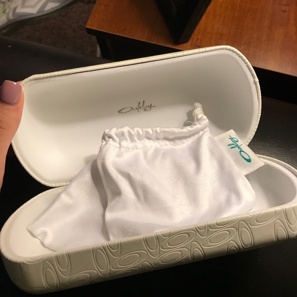 White Oakley sunglasses case.