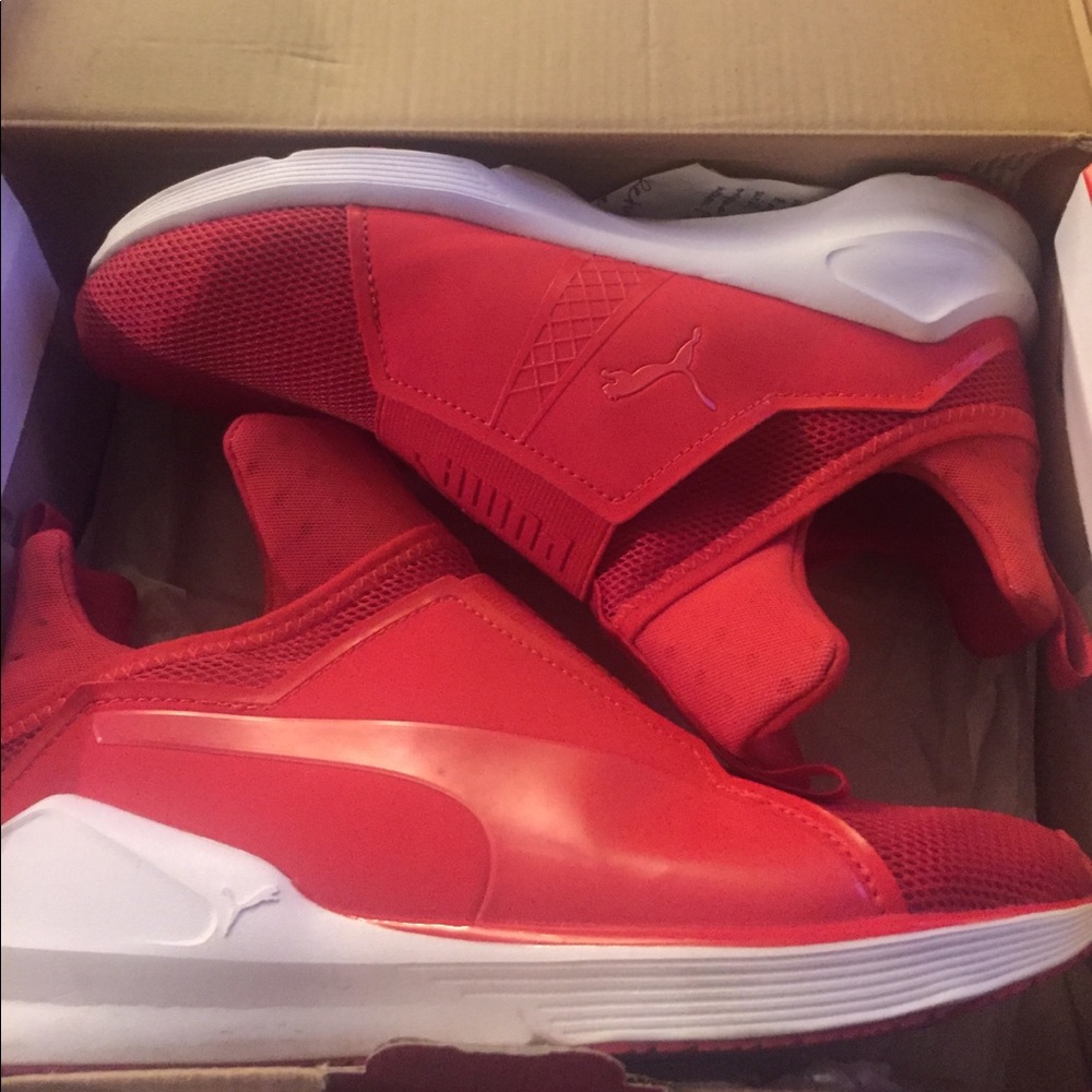 Red and white puma trainers