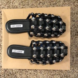 Black caged studded sandals.
