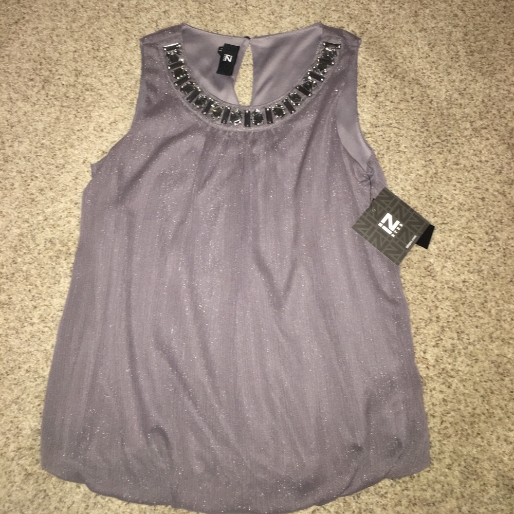 Women’s blouse with subtle sparkles and jewels