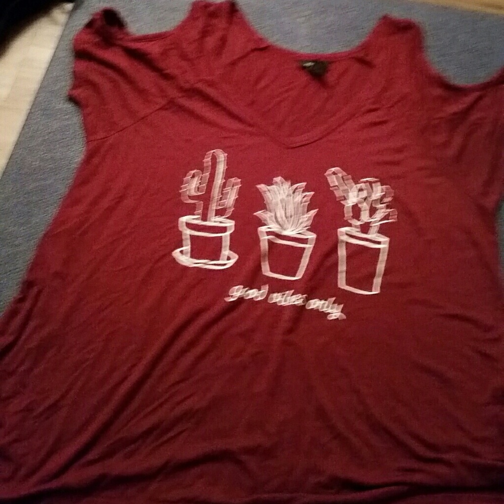 A dark red cut out shirt. Worn a few times